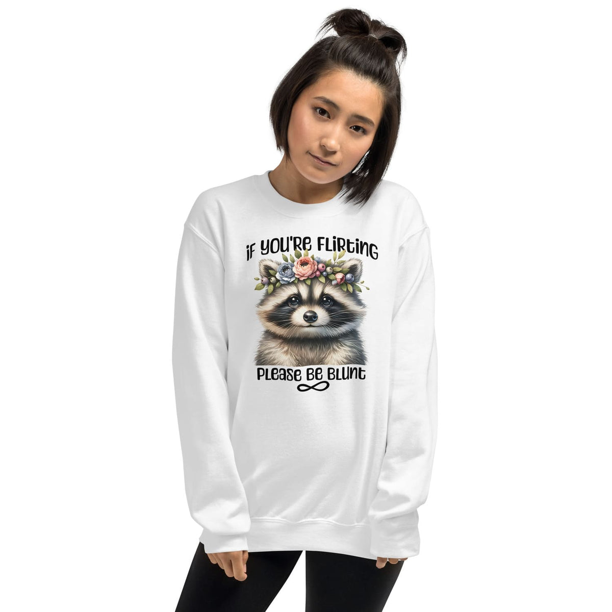 Person wearing a white funny autistic sweatshirt with a raccoon graphic and text on a white background