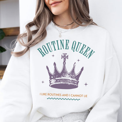 Person wearing a white sweatshirt with 'Routine Queen' text and crown graphic.