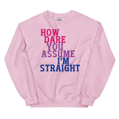Pink bisexual sweatshirt with text 'HOW DARE YOU ASSUME I'M STRAIGHT' on a white background