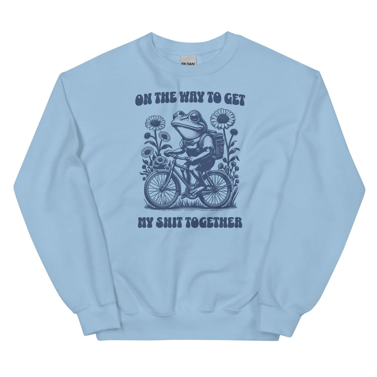 Light blue mental health sweatshirt with a graphic of a frog riding a bike and text on a white background
