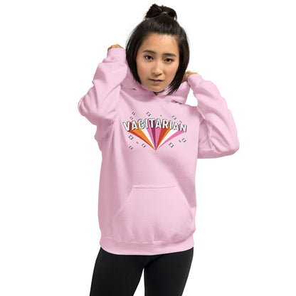 Person wearing a pink lesbian hoodie with 'Vagitarian' text design on a white background