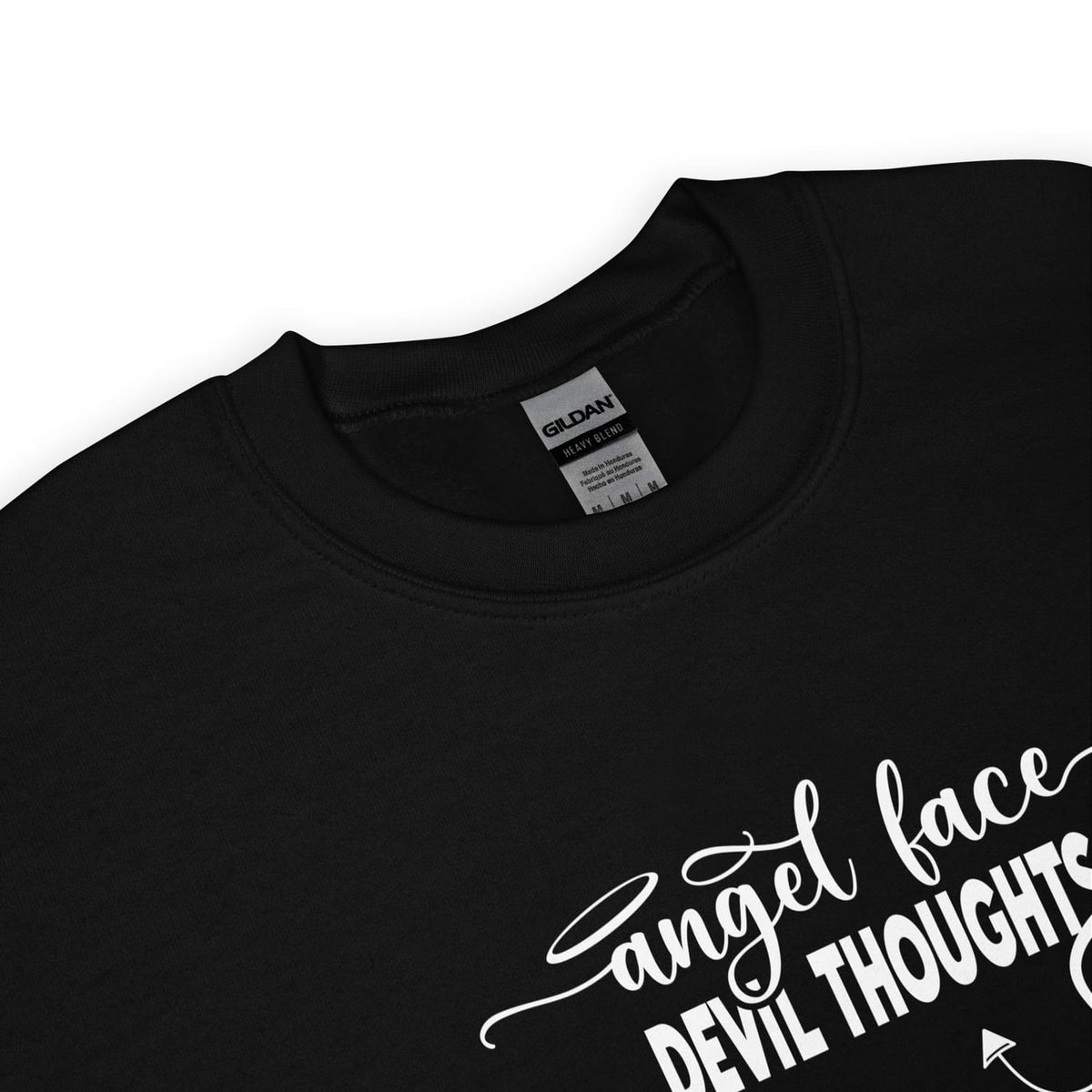 detail of black sweatshirt with white text 'Angel face devil thoughts' on a white background