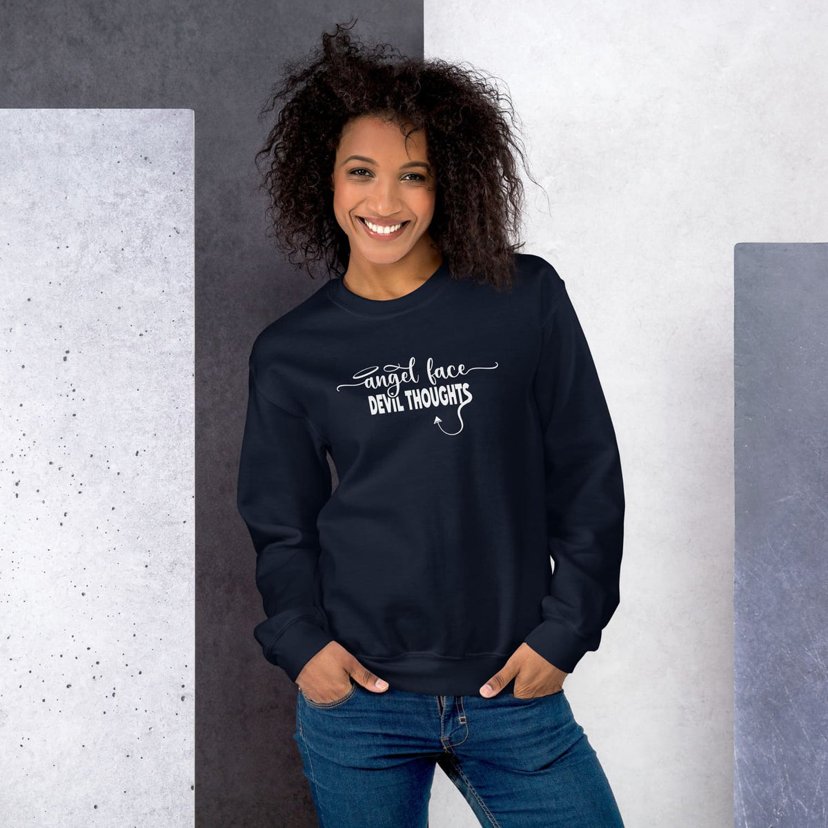 Woman wearing a navy Funny naughty sweatshirt with text angel face devil thoughts