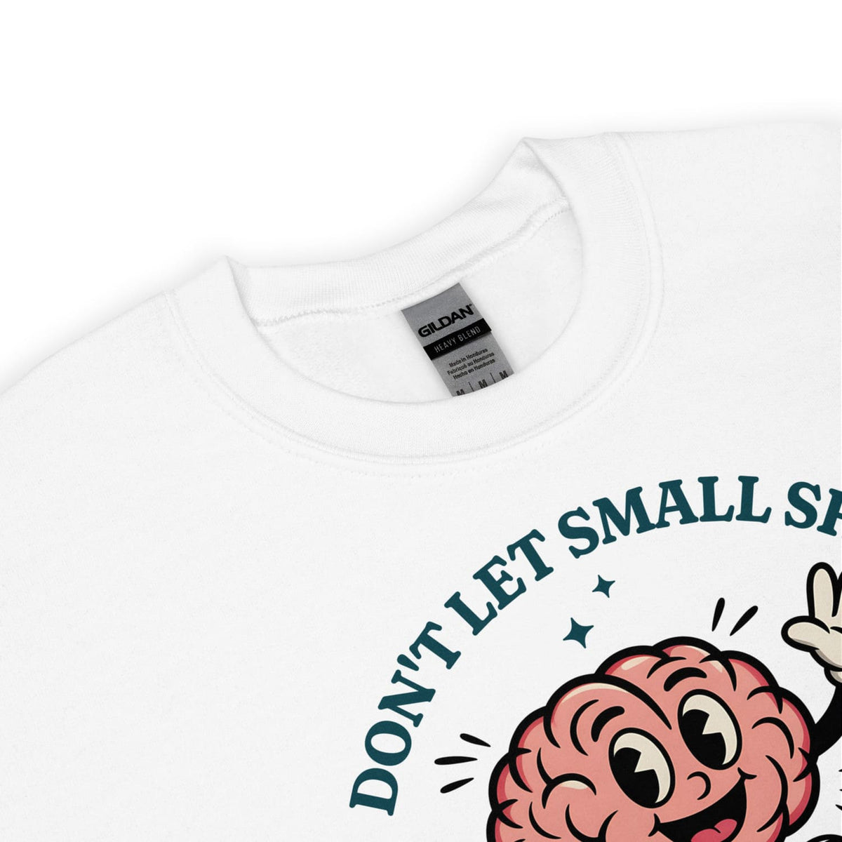 White positivity sweatshirt with a cartoon brain graphic and text 'Don't let small stuff' on a white background.