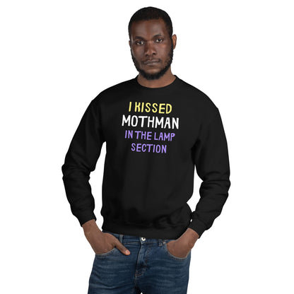 Man wearing a black nonbinary mothman sweatshirt with humorous text design on a white background