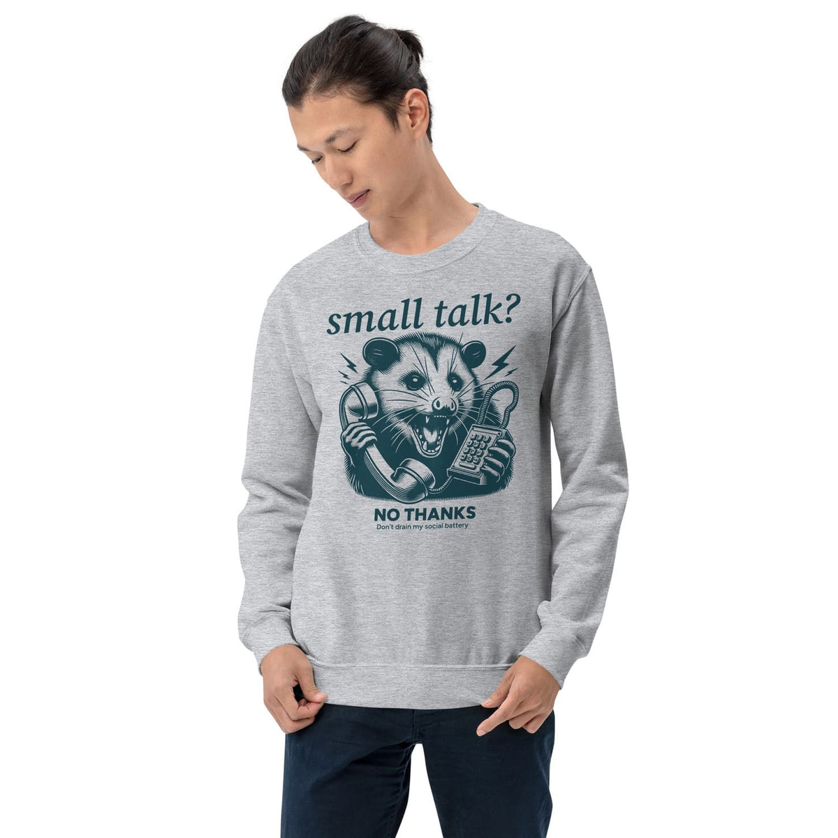Person wearing a gray sweatshirt with a social anxiety graphic design and text on a white background