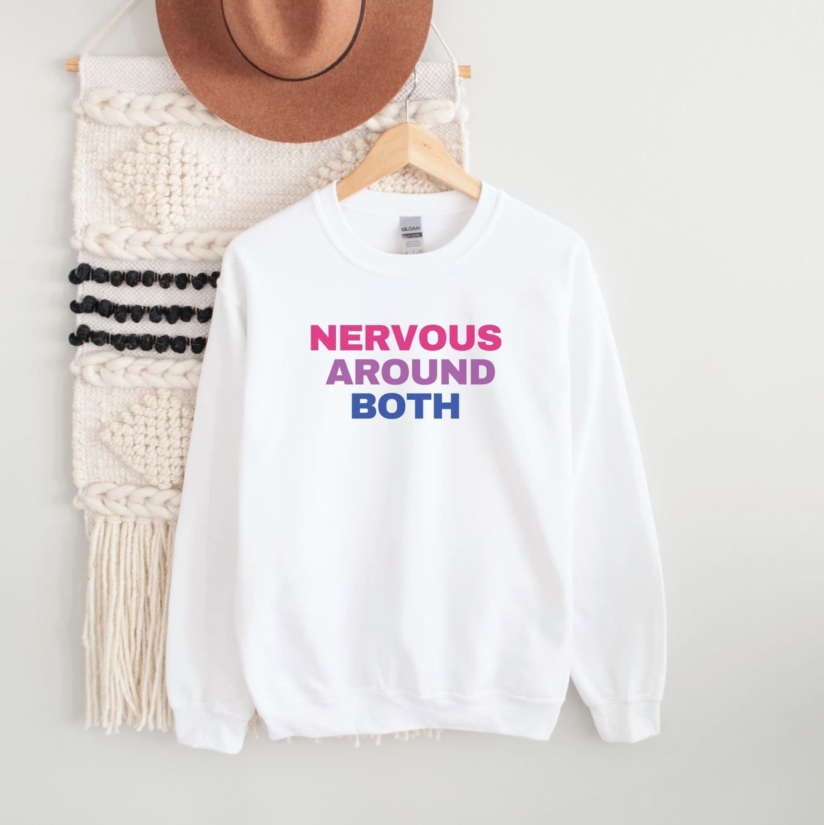White bisexual sweatshirt with 'Nervous Around Both' text on a white background