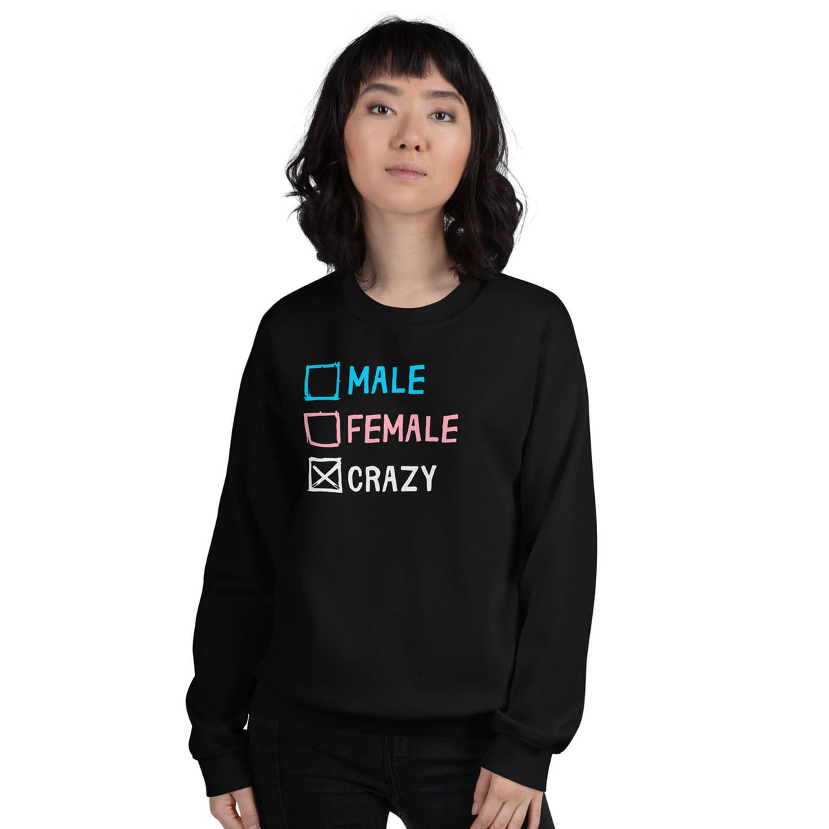 Trans person wearing a funny transgender pride sweatshirt with text choices on a white background
