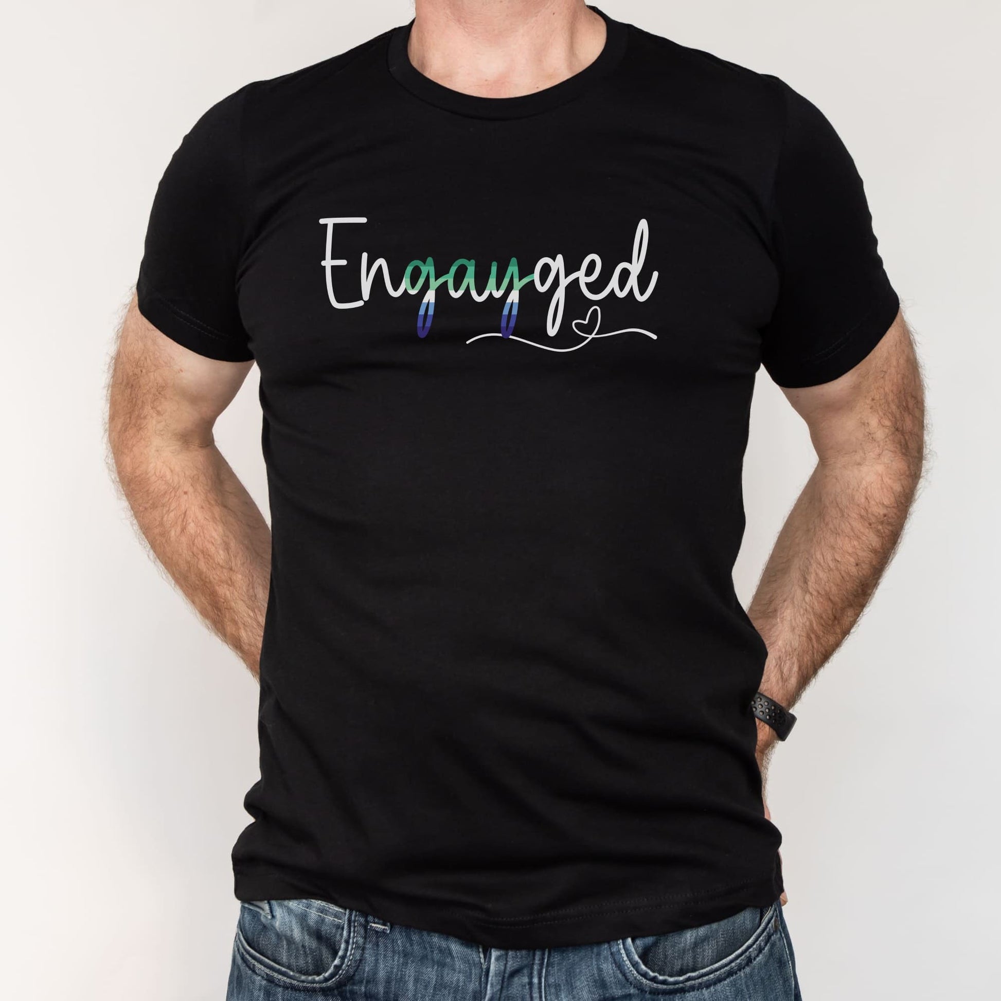 Black t-shirt with gay MLM engagement 'Engayged' text on a plain background