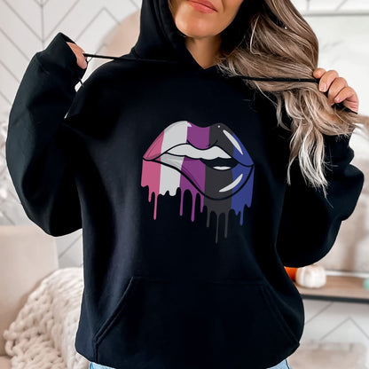 Person wearing a black hoodie with a colorful genderfluid lips design.