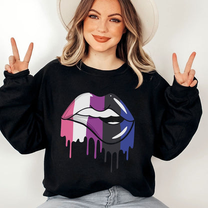 Genderfluid person wearing a black sweatshirt with a colorful lip design, making peace signs.