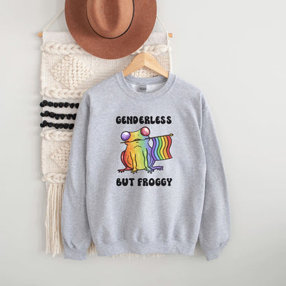 Gray sweatshirt with a rainbow agender or nonbinary frog graphic and text, hanging on a white wall with a hat and bag in the background.