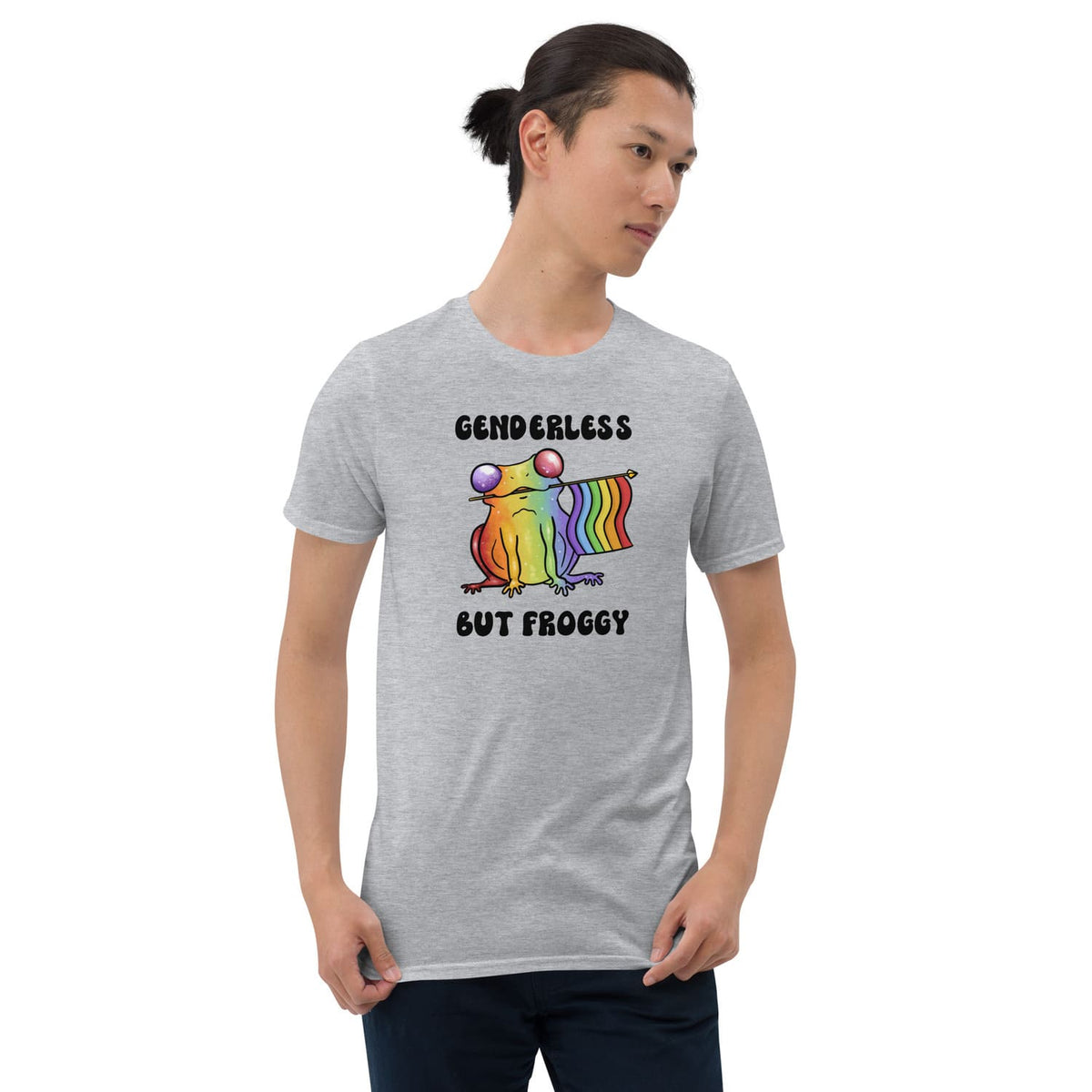 Person wearing a gray t-shirt with a rainbow agender or nonbinary frog graphic and text on a white background