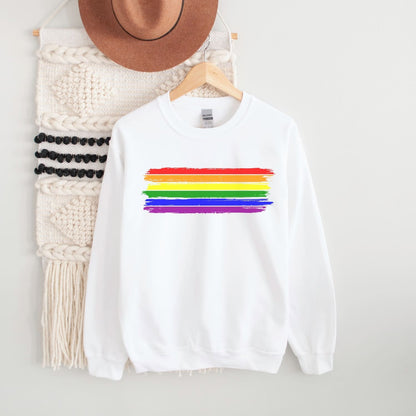 White pride sweatshirt with rainbow stripe design on a hanger against a white background