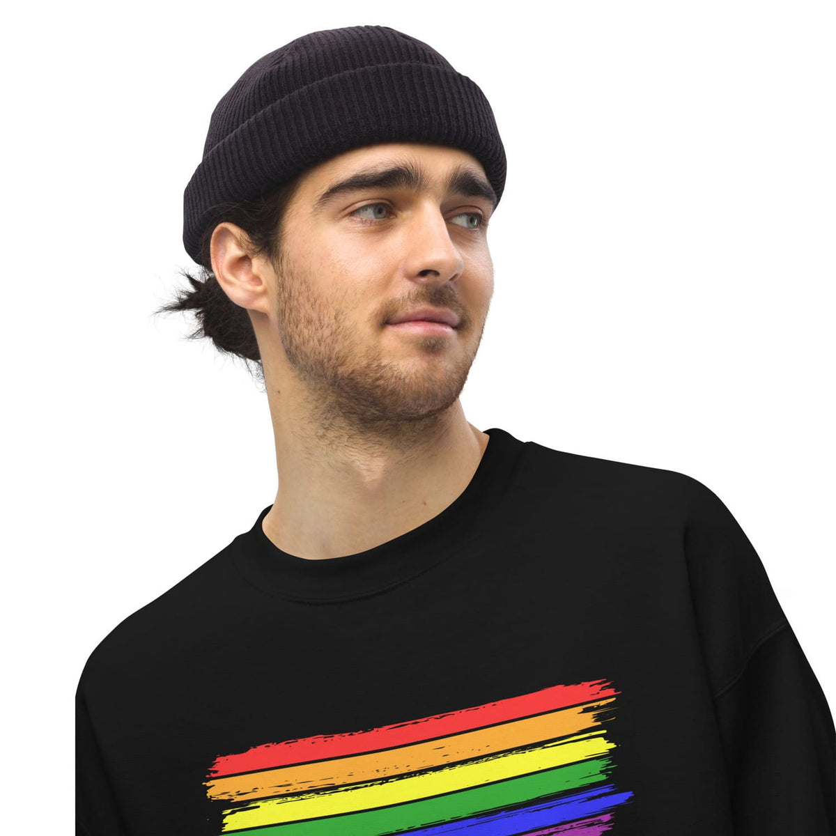 Man wearing a black sweater with a rainbow pride flag design on a white background