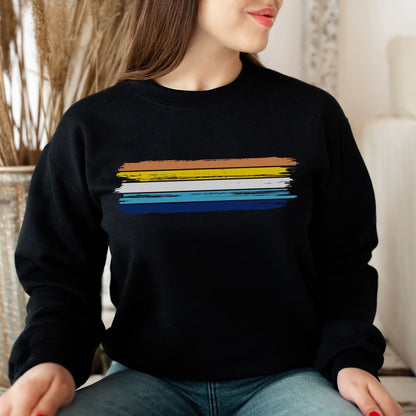 Person wearing a black aroace sweatshirt with grunge pride flag sitting indoors.