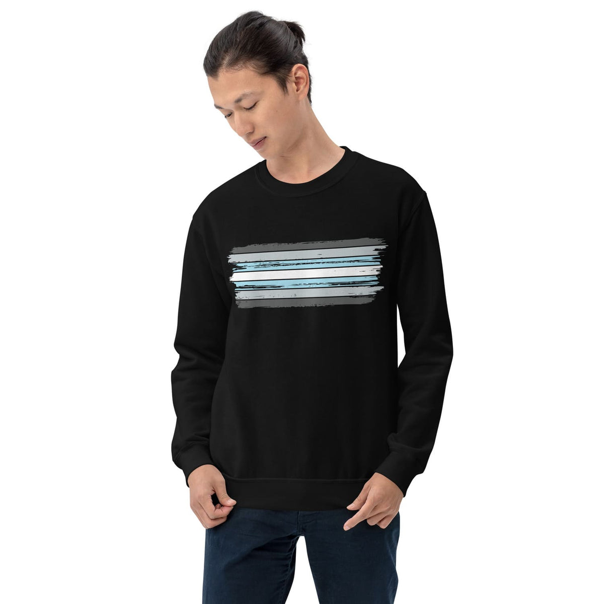 Person wearing a black demiboy sweatshirt with a colorful graphic on a white background