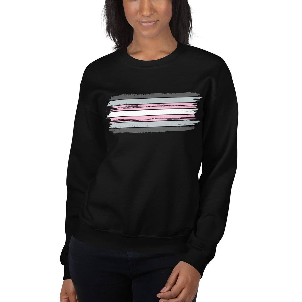 Person wearing a black demigirl sweatshirt with a colorful stripe design on a white background