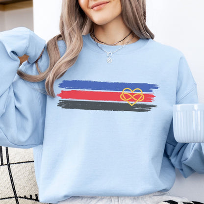 woman wearing bue sweatshirt with grunge polyamory flag