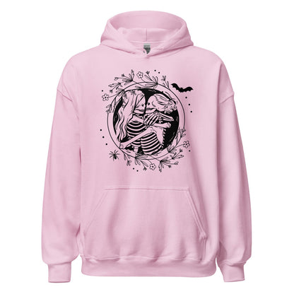Pink hoodie with hugging lesbian skeleton couple design on a white background