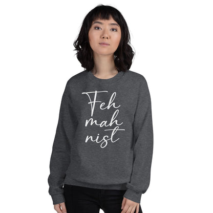Person wearing a dark gray feminist sweatshirt with 'Feh mah nist' text on a white background