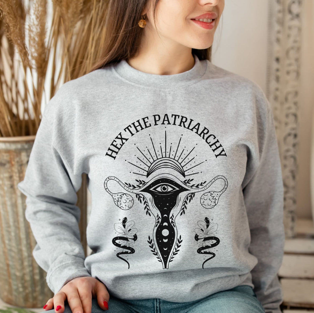 woman wearing hex the patriarchy feminist sweatshirt