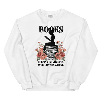 White sweatshirt with a graphic of a person reading books and flowers, with text 'Books helping introverts avoid conversations' on a white background.