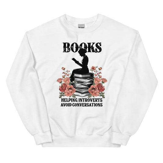 White sweatshirt with a graphic of a person reading books and flowers, with text 'Books helping introverts avoid conversations' on a white background.