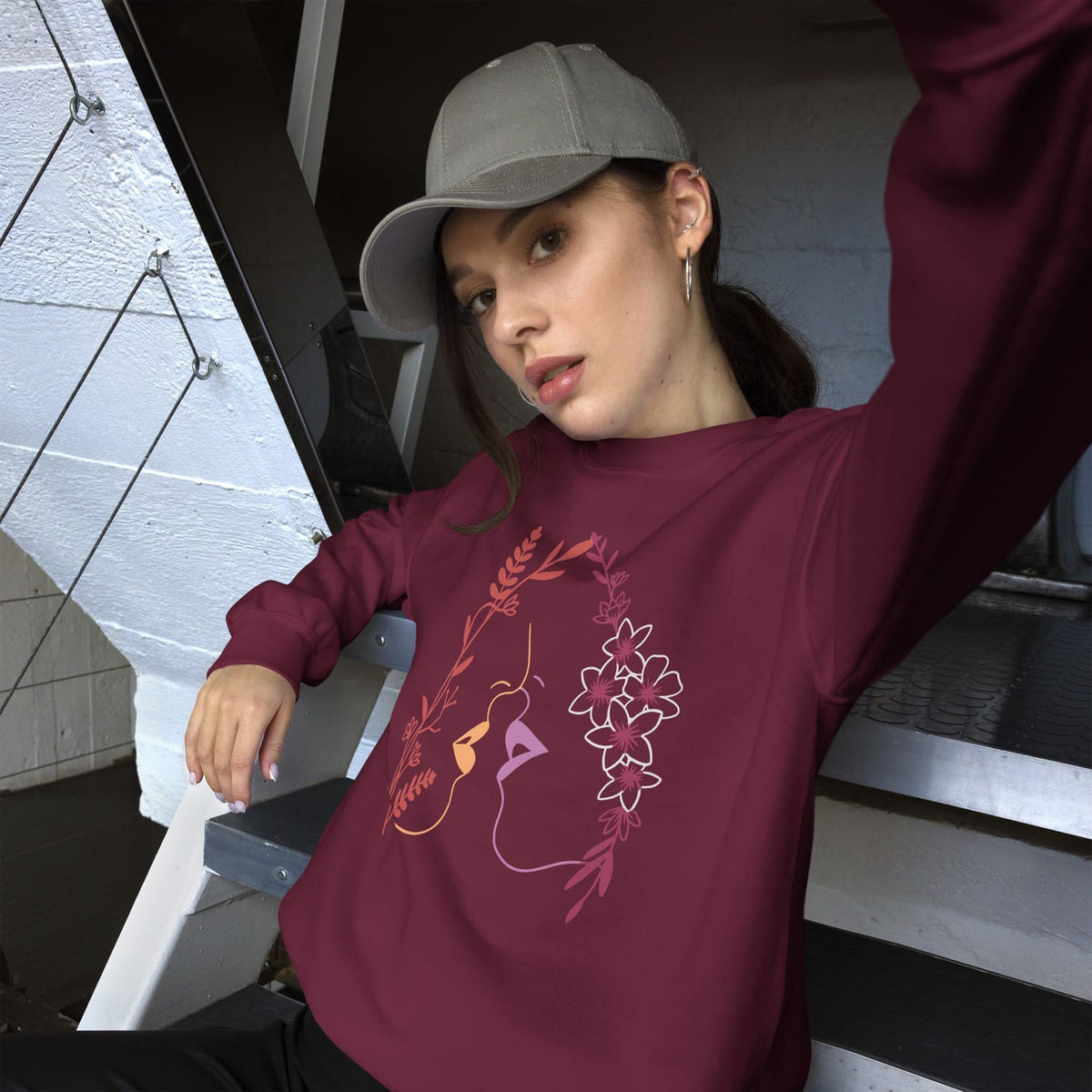 woman wearing sweatshirt with subtle lesbian line art
