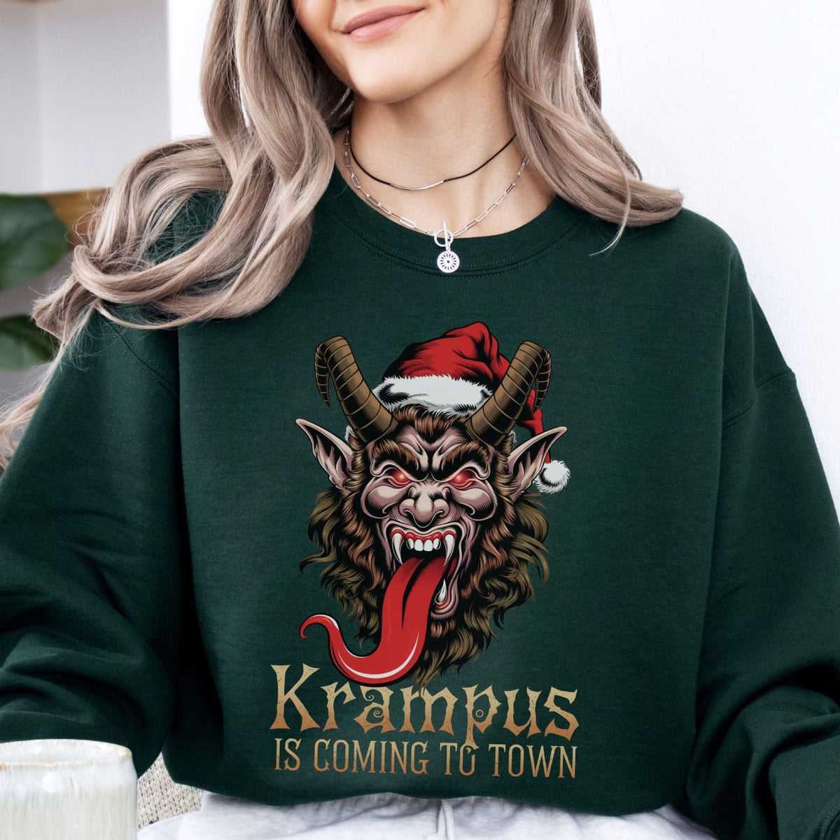 Person wearing a green sweatshirt with Krampus design and text