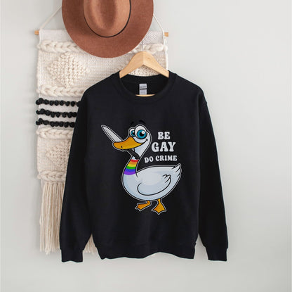 Black LGBTQ ally sweatshirt with a graphic of a duck and text on a hanger against a white wall.