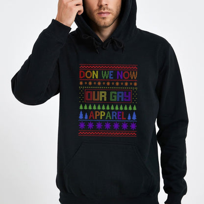 Person wearing a black pride christmas hoodie with colorful rainbow text and patterns on a white background