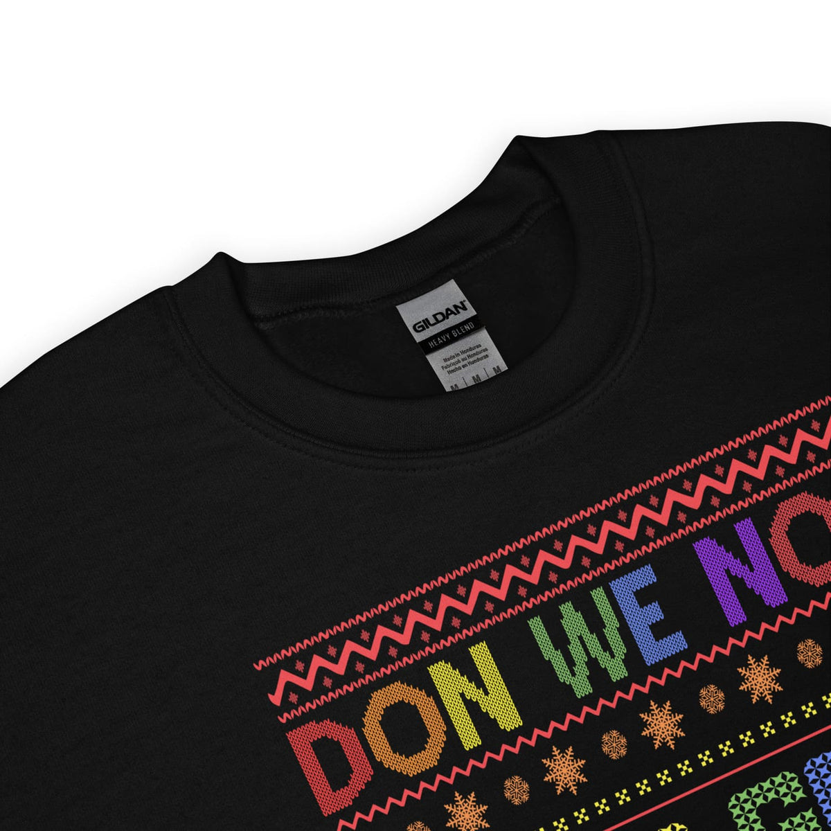 funny holiday season sweatshirt with colorful lgbtq pride text and patterns on a white background