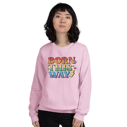 Person wearing a pink lgbtq pride sweatshirt with 'Born This Way' text on a white background