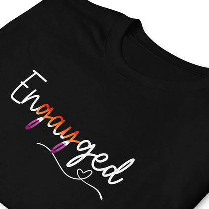 Black wedding announcement t-shirt with 'Engayged' text in lesbian sunset flag colors and a heart on a white background