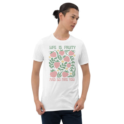 Man wearing a white t-shirt with a fruit-themed design and text on a white background: Funny Fruity Shirt, Subtle Queer Tee, Summer Strawberry T-Shirt, Pastelcore LGBTQ Outfit, Botanical Gay Lesbian Trans Bi Pan Ace Enby Gift