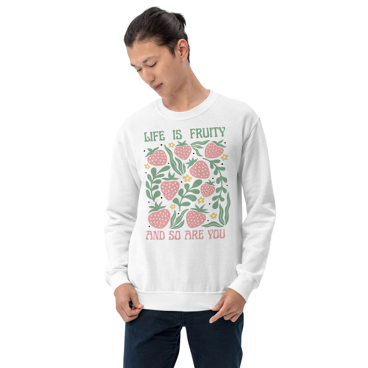 Person wearing a white queer sweatshirt with a fruit-themed design and text on a white background