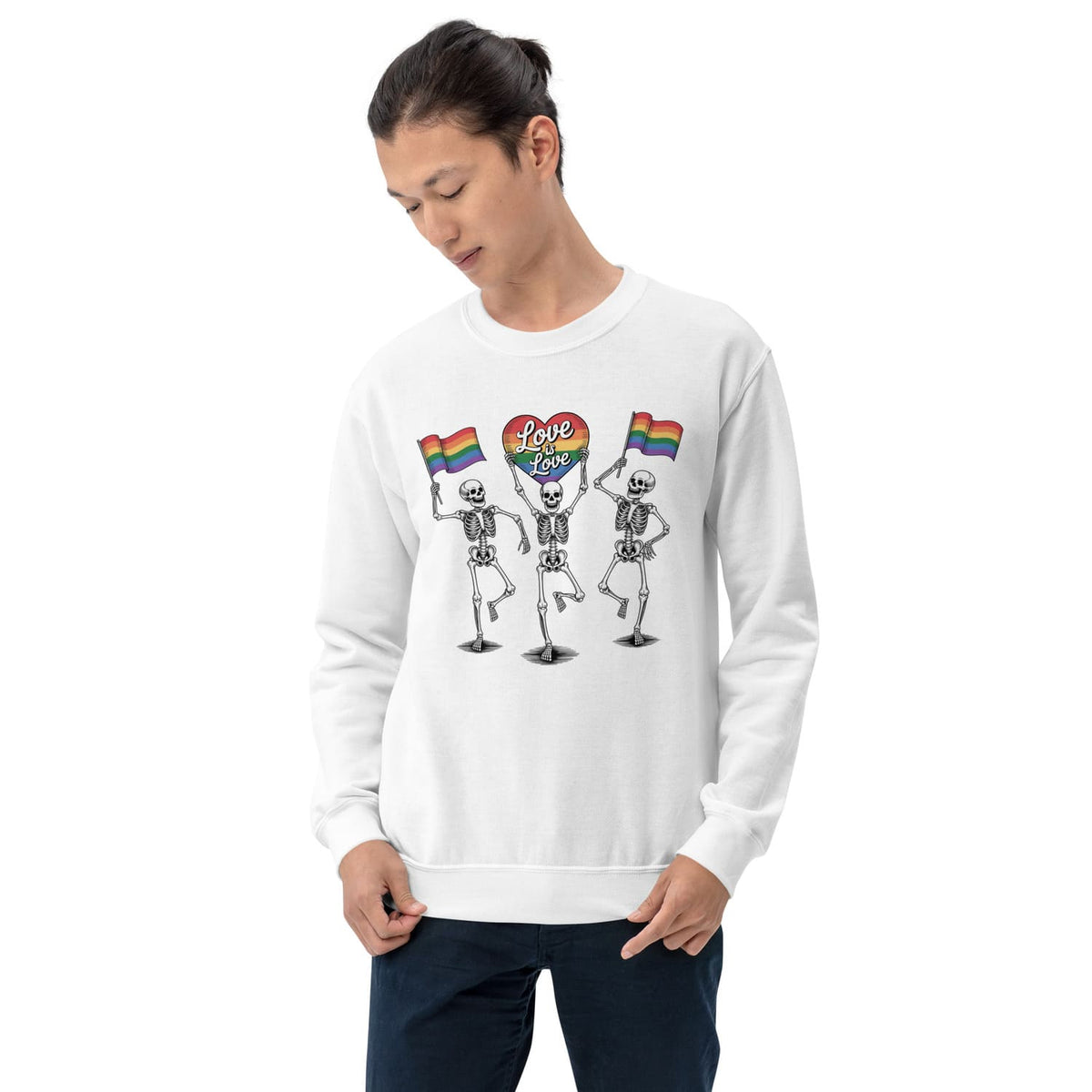 Person wearing a white sweatshirt with skeletons holding rainbow flags 'love is love' and a heart symbol.