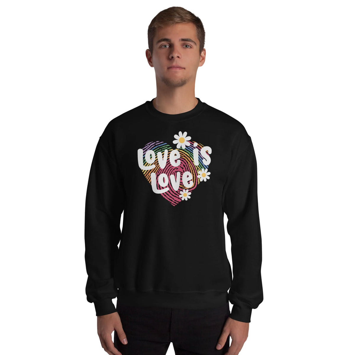 Person wearing a black pride lgbtq sweatshirt with 'Love is Love' and heart design on a white background