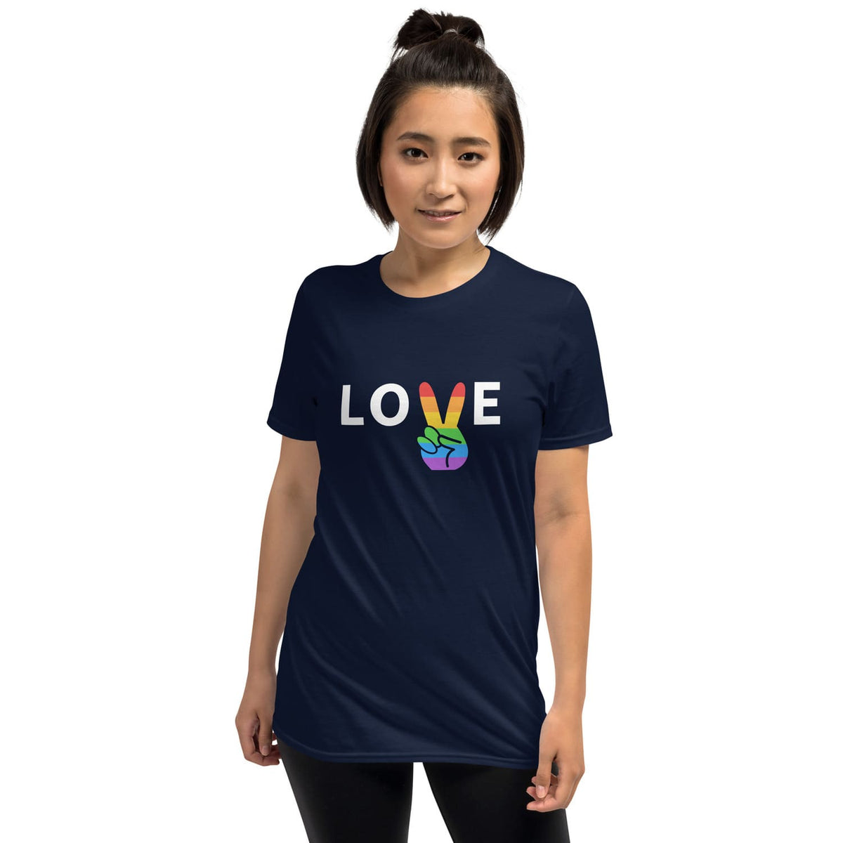 Person wearing a navy blue t-shirt with 'LOVE' printed on it, featuring colorful letters.