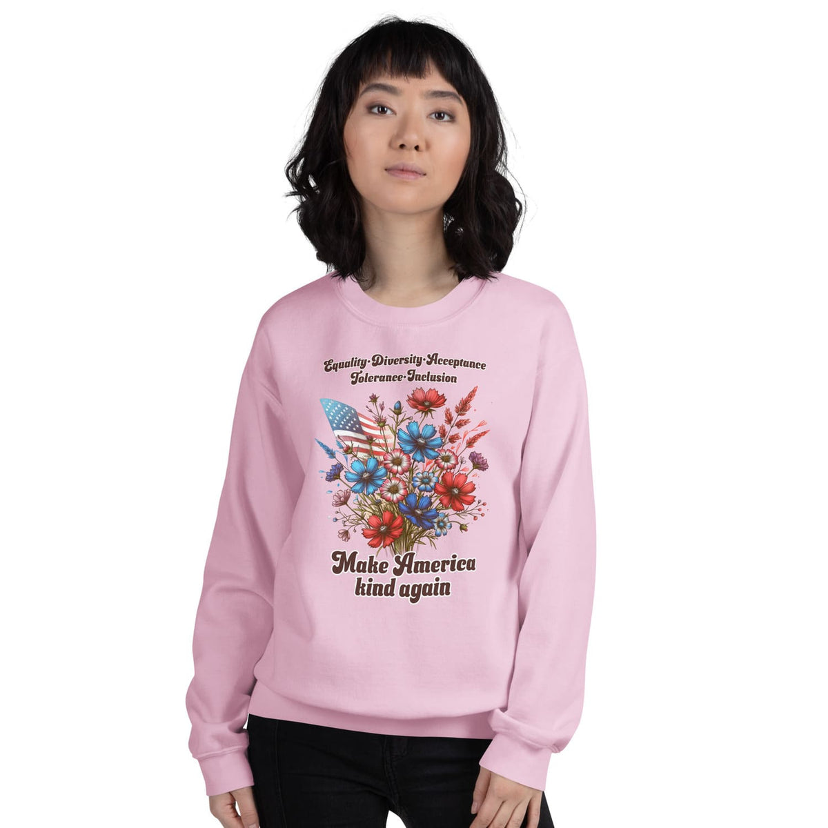 Person wearing a pink patriotic american sweatshirt with a floral design and text on a white background