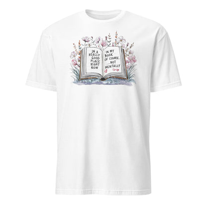White t-shirt with a book and floral design on a white background