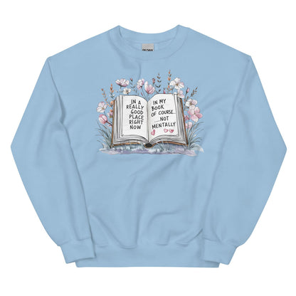Light blue mental health sweatshirt with a graphic of an open book and flowers on a white background