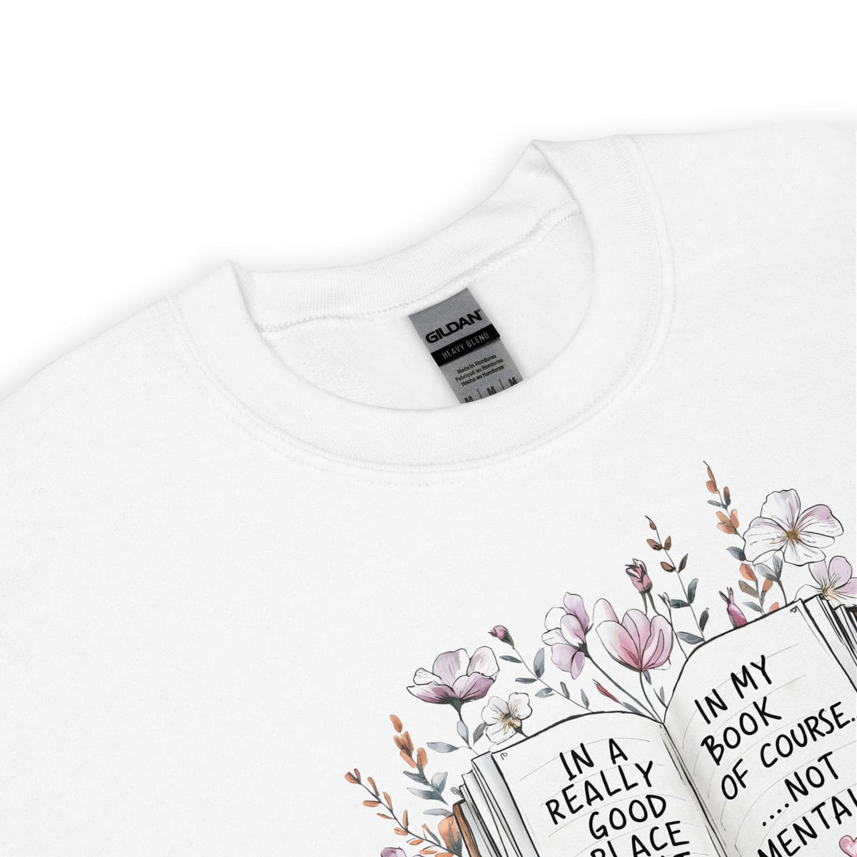 White mental health sweatshirt with floral bookish design and text on a white background