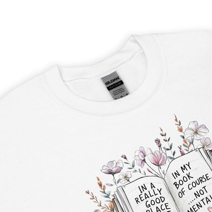 White mental health sweatshirt with floral bookish design and text on a white background