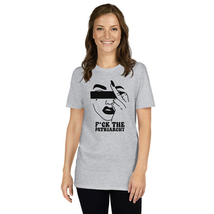Woman wearing a gray feminist t-shirt with a graphic design and text on a white background