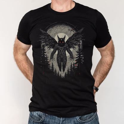 Black t-shirt with mothman graphic worn by a person on a plain background