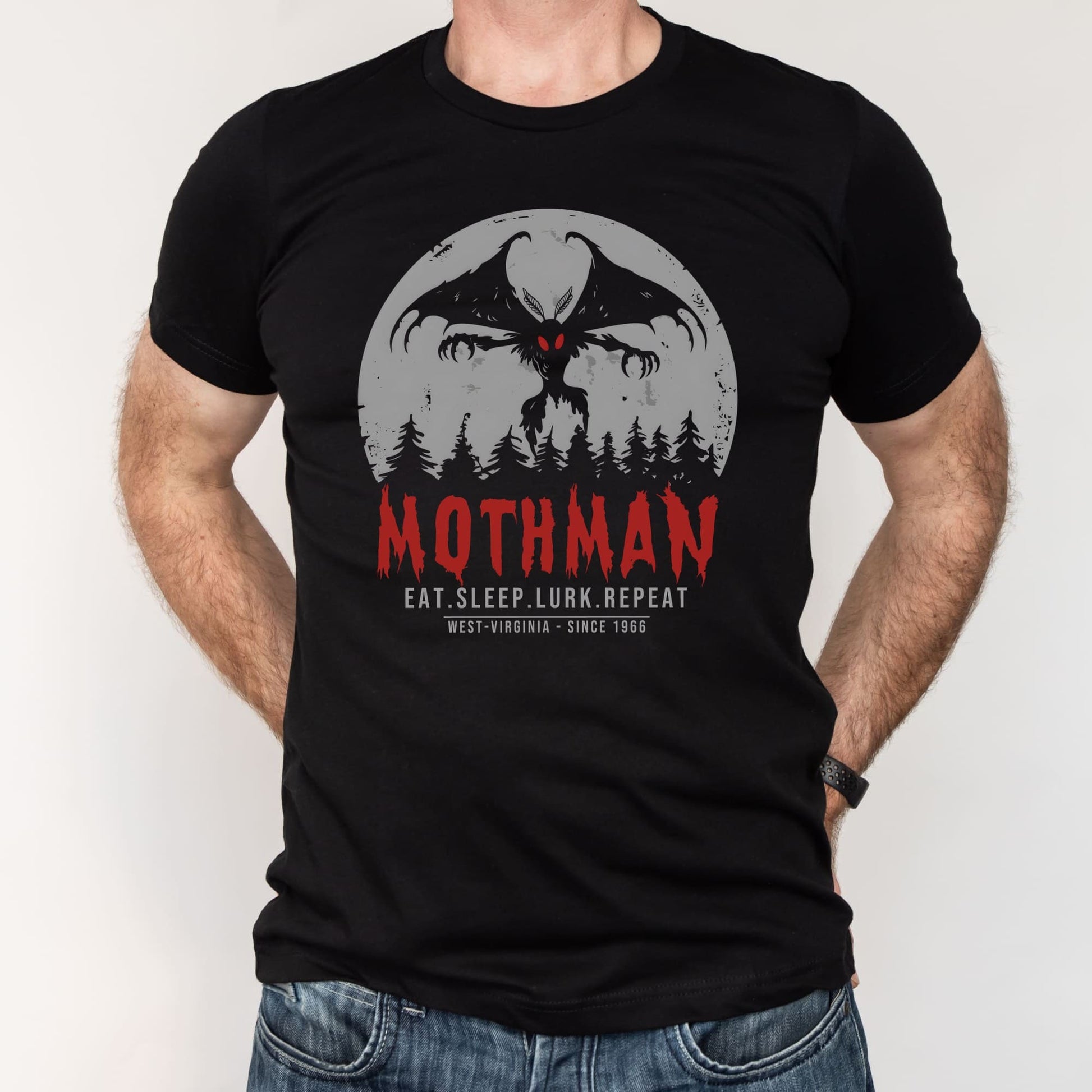 Black t-shirt with Mothman graphic and text on a white background