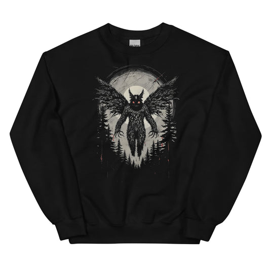 Black sweatshirt with a mothman graphic design in a forest at night.