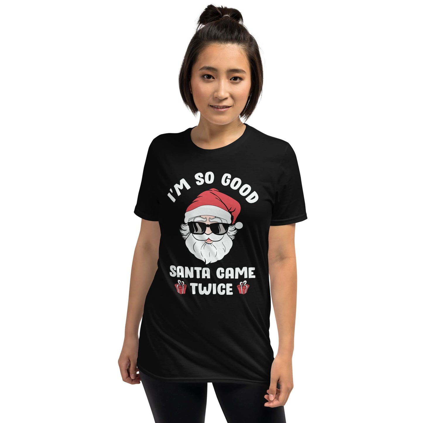 Person wearing a black t-shirt with a humorous Christmas design on a white background
